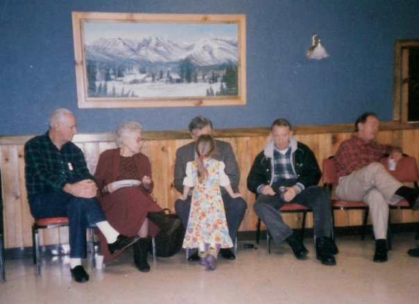Sam Fife's wife Lee sitting with Bill Grier speaking with an unknown child, then C.E. "Buddy" Cobb, who became Sam Fife's predecessor, and Joe McChord